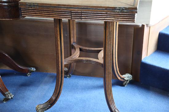 A pair of ebony strung burr walnut envelope card tables, W.1ft 11in. D.1ft 11in. H.2ft 5in.
